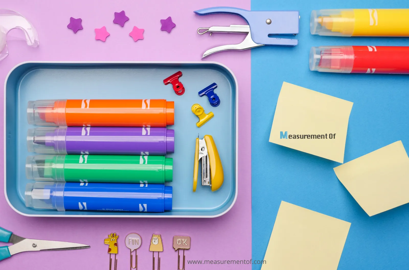 Highlighters, post it note papers, scissors and other stationery items on a surface