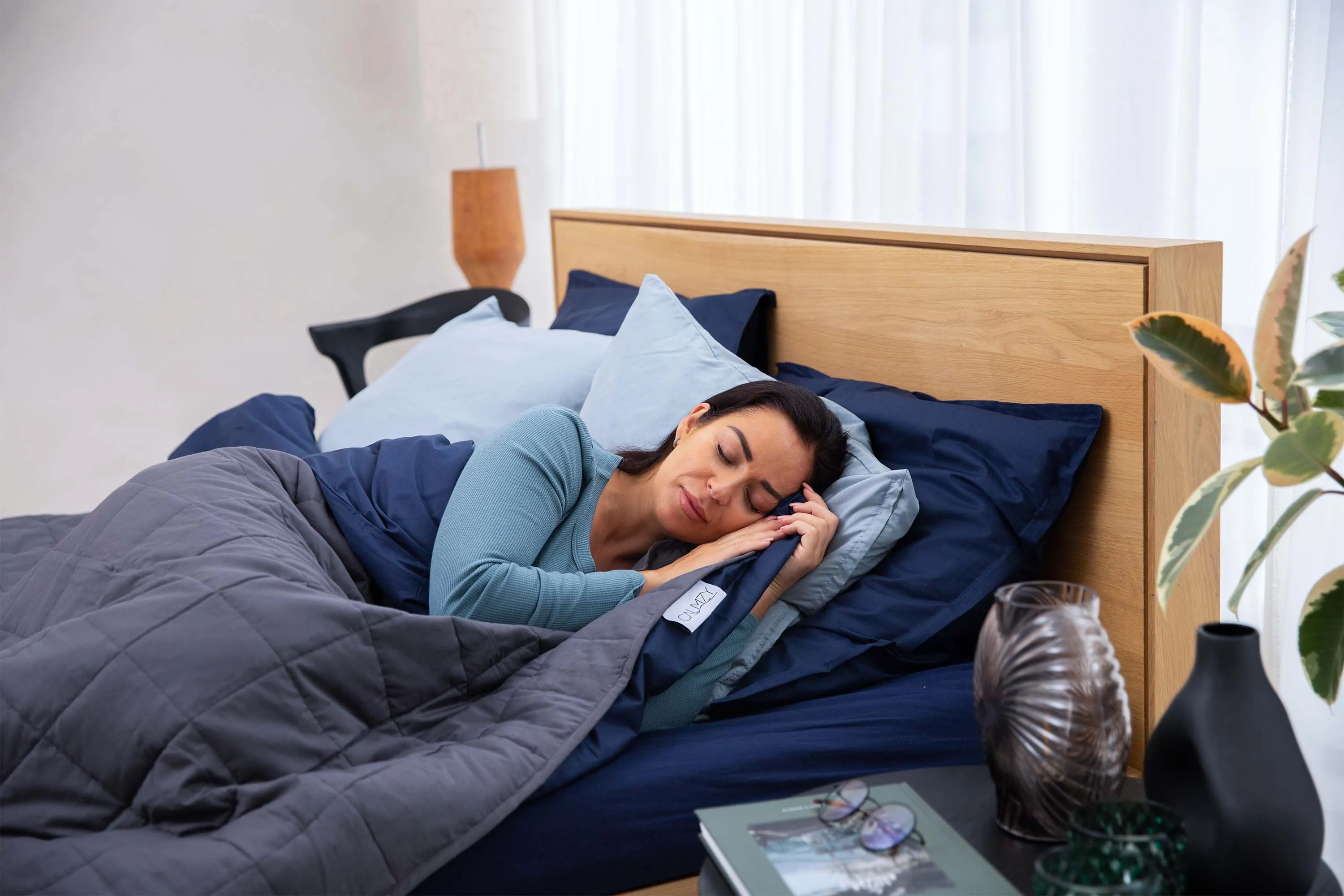 Person sleeping under weighted blanket