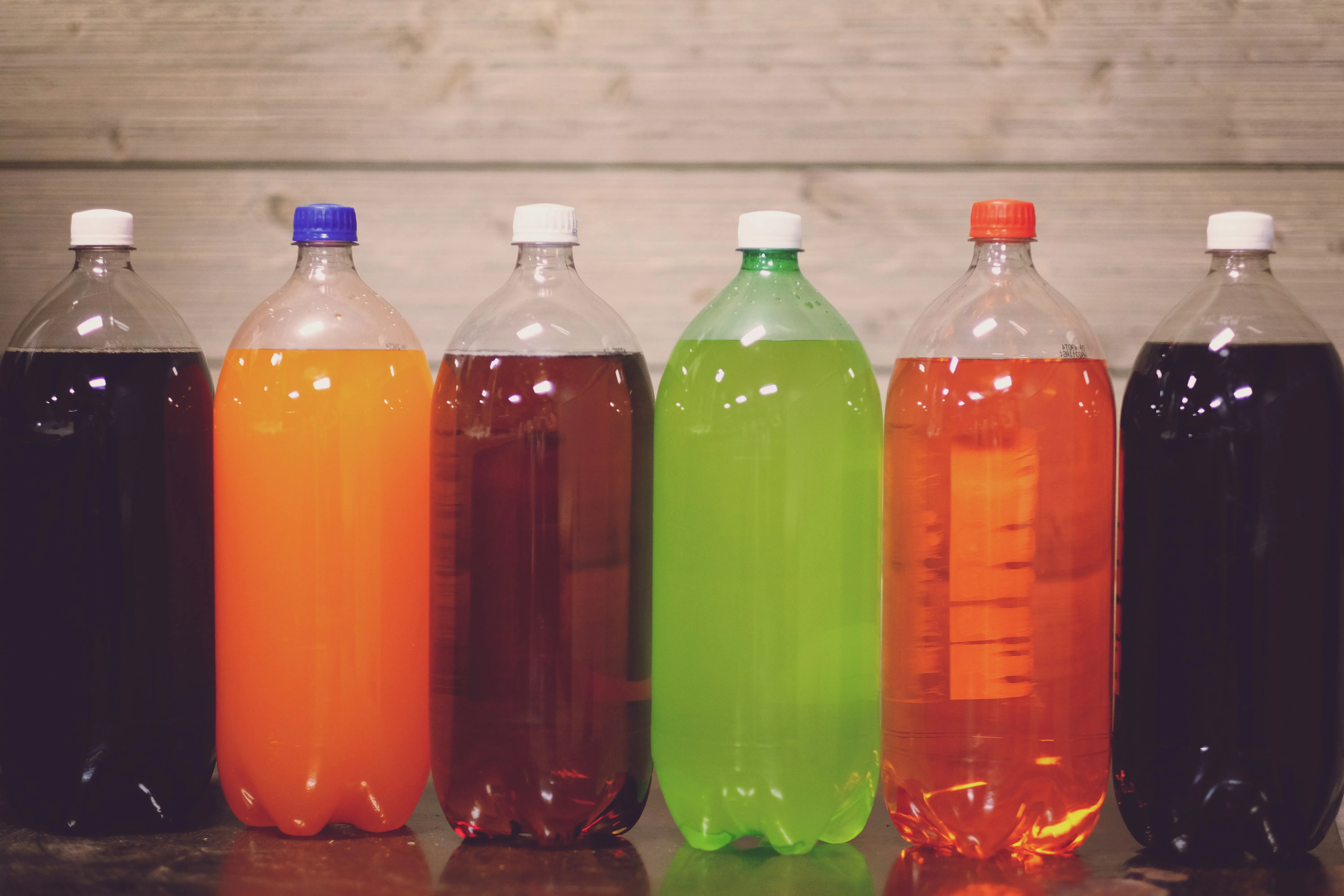 6 bottles of different flavoured soda.