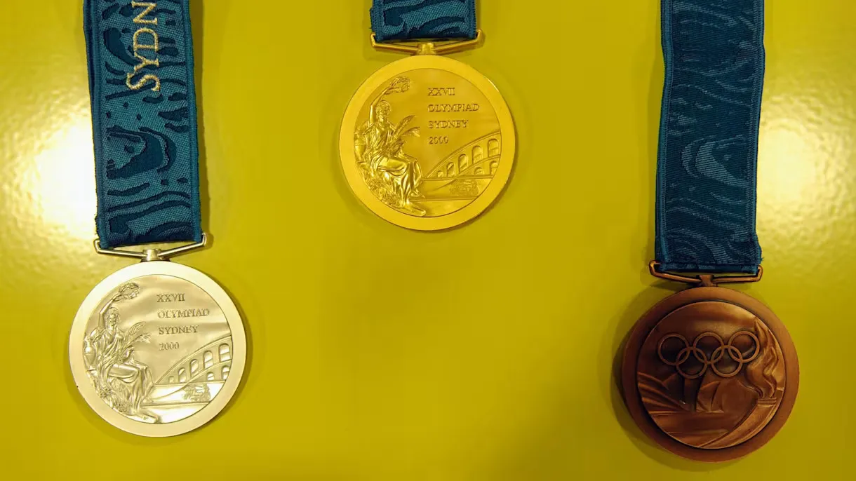 Three of the Sydney medals displayed